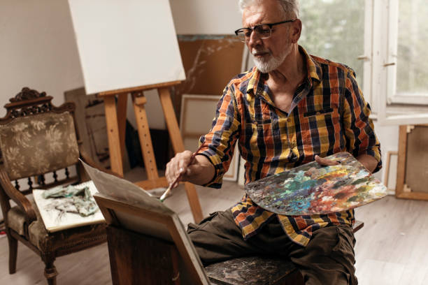 istock Senior adult artist working 1083669302