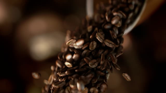 Falling coffee beans in super slow motion in 4K