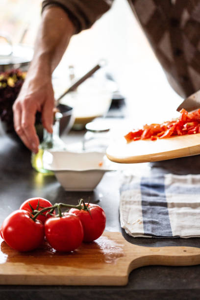 istock Senior man preparing vegetable salad 1083675044