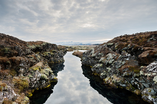 This photograph is of the Silfra where the tectonic places of North America and Eurasia meet in Thingvellir National Park, a travel destination along the Golden Circle in Iceland.