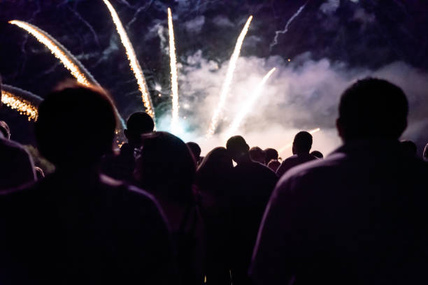 istock Crowd watching fireworks and celebrating new year eve 1083678806