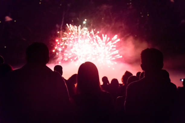 istock Crowd watching fireworks and celebrating new year eve 1083679948
