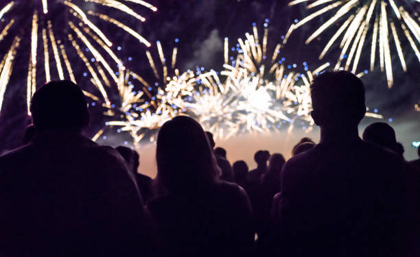 istock Crowd watching fireworks and celebrating new year 1083680036