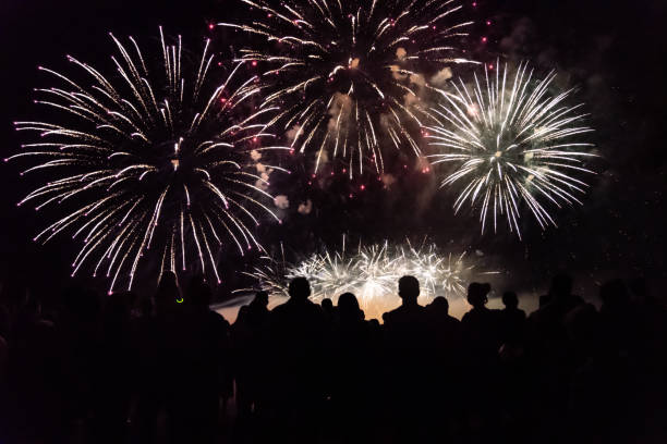 istock Crowd watching fireworks and celebrating new year 1083680054