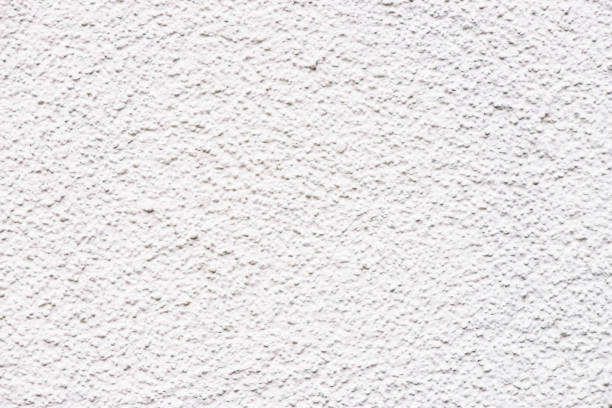 istock Light white wall close-up. Detailed architecture minimalist textured background with copy space. Texture of white painted concrete. Perfectly white surface. Whitewashing wall. Rough clean texture. 1083683180