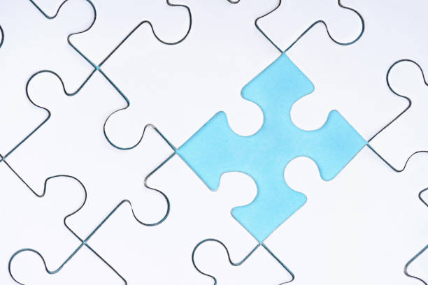istock full frame of white puzzles arrangement on blue backdrop 1083684128