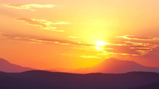 Time-lapse footage of the sun setting behind the mountain in Crimea, Ukraine. Beauties of Nature concept video.