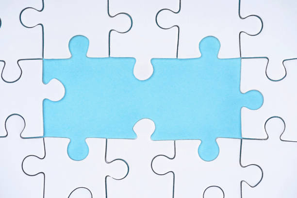 istock top view of white puzzles arrangement on blue background 1083684236