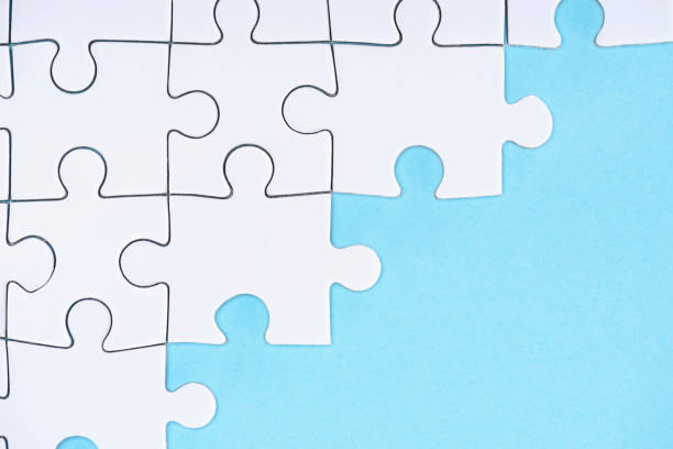 istock top view of white puzzles arrangement on blue background 1083684262