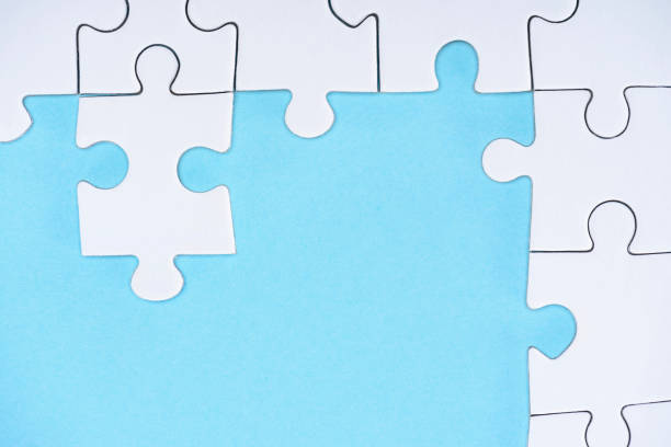 istock top view of white puzzles arrangement on blue background 1083684268