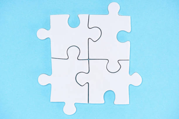 istock top view of arranged white puzzle elements on blue backdrop 1083684274