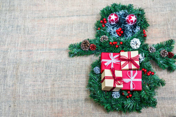 istock Christmas gift boxes with baubles and fir tree branch 1083685810