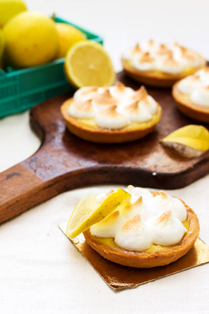 istock Meyer Lemon Tartlets with Lemon Curd on cutting board 1083686118