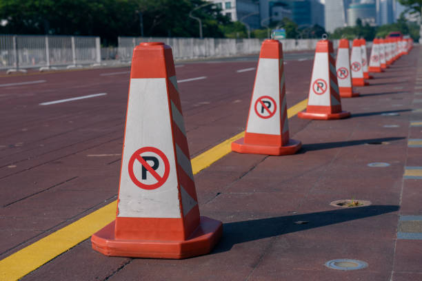 istock Row of road cone with no parking sign 1083686762