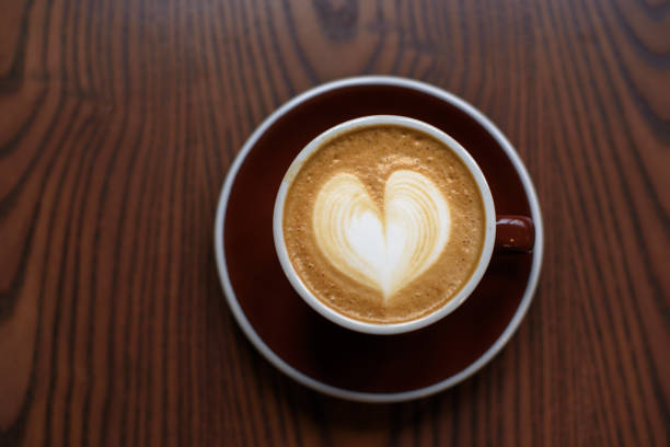 istock Coffee latte on wooden table 1083687300