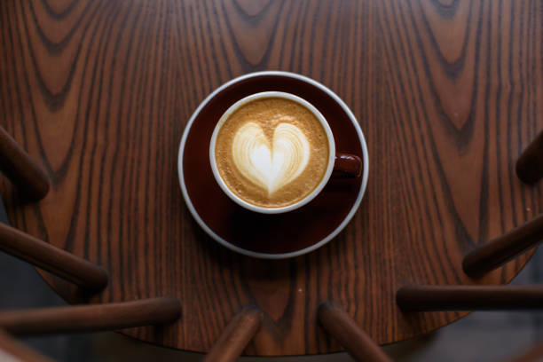istock Coffee latte on wooden table 1083688338