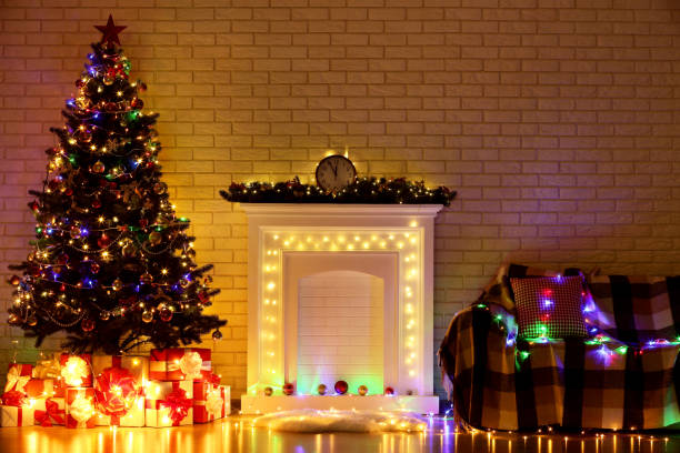 istock White decorated fireplace near christmas tree and sofa on brick wall background 1083690062