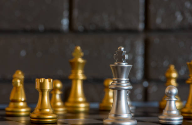 istock Chess pieces placed on top of a board 1083693024