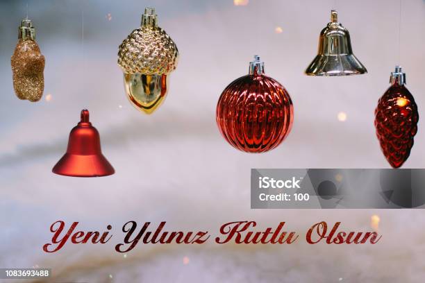 Shiny Gold And Red Christmas Balls And Bells For New Year Yeni Yiliniz Kutlu Olsun Means Happy New Year Stock Photo - Download Image Now