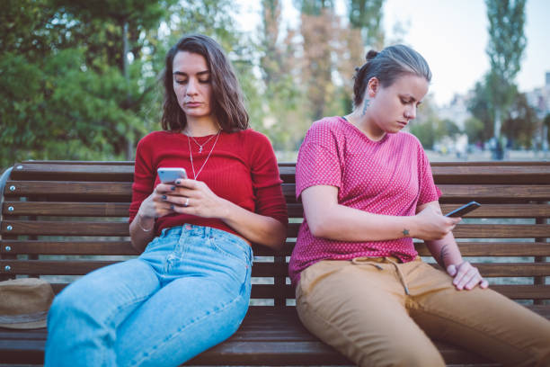 Couple with problems texting outside and not talking to each other