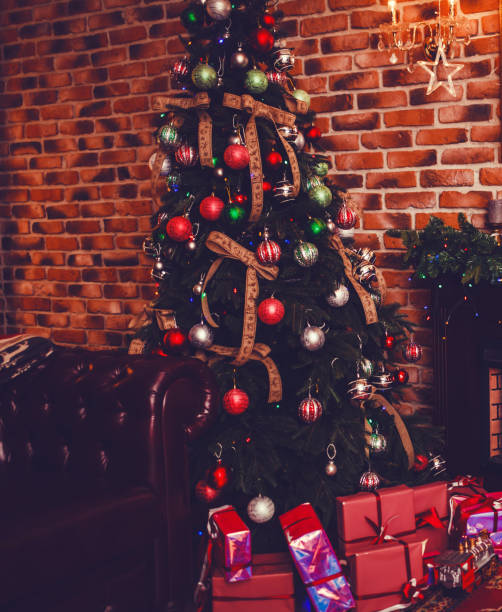 istock Christmas scene with tree gifts 1083693850