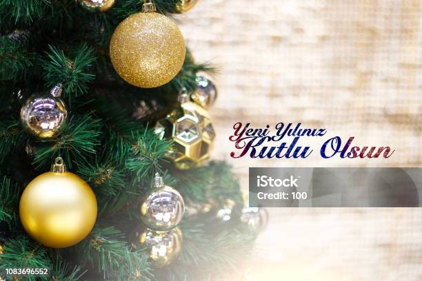 Shiny Gold And Silver Christmas Balls On White With Pine Tree Yeni Yiliniz Kutlu Olsun Means Happy New Year Stock Photo - Download Image Now