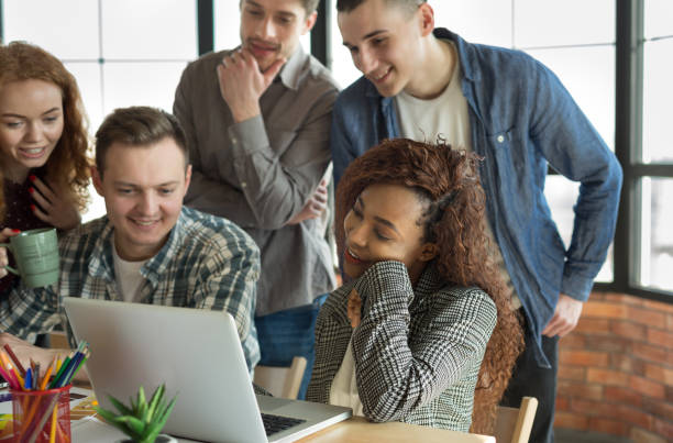 istock Black woman looking at interior design project in laptop 1083698136