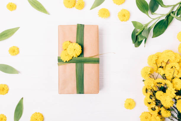 istock Gift box in brown eco paper on white table 1083701294