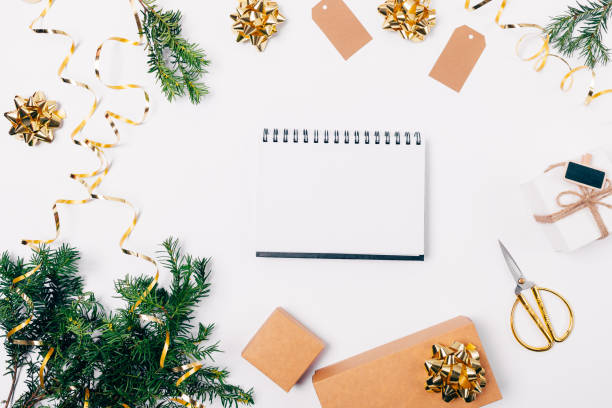 istock Open blank notepad in center of festive flat lay composition 1083701420