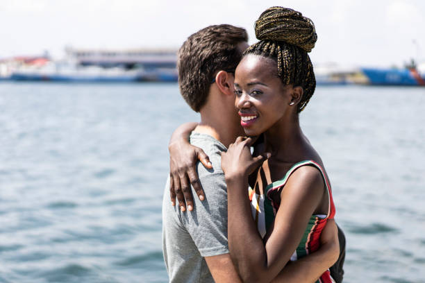 istock Man welcomes his girlfriend on pier 1083703638