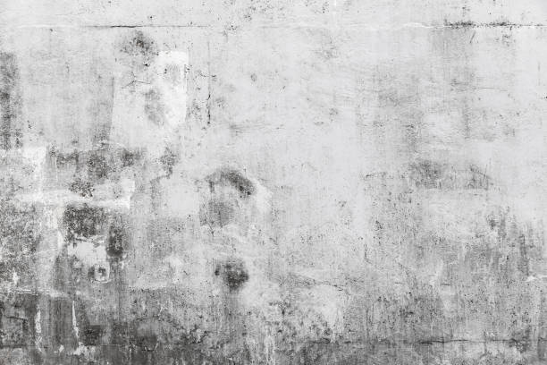 istock Grungy concrete wall with white paint brush strokes 1083710990