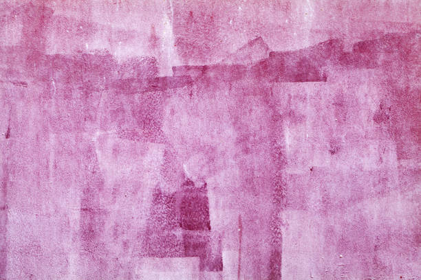 istock Concrete wall with pink paint layer, grungy background 1083711000