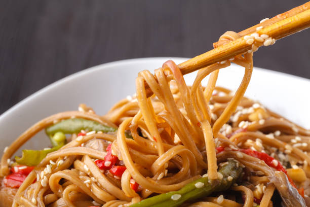 istock Brown paste with oyster mushrooms and tomatoes in a plate on the table 1083713936