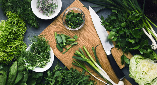 istock Cutting greenery assortment on kitchen wooden board 1083714670