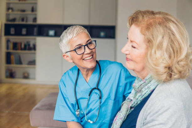 istock Smiling nurse with a patient 1083718022