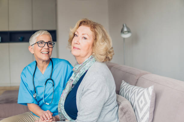 istock Smiling nurse with patient 1083718028