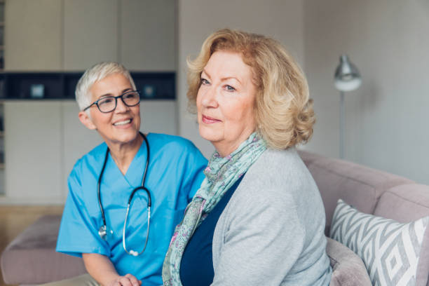 istock Woman sitting next to a nurse 1083718032