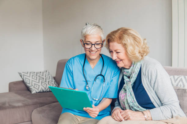 istock Smiling women revising medical paperwork 1083719356
