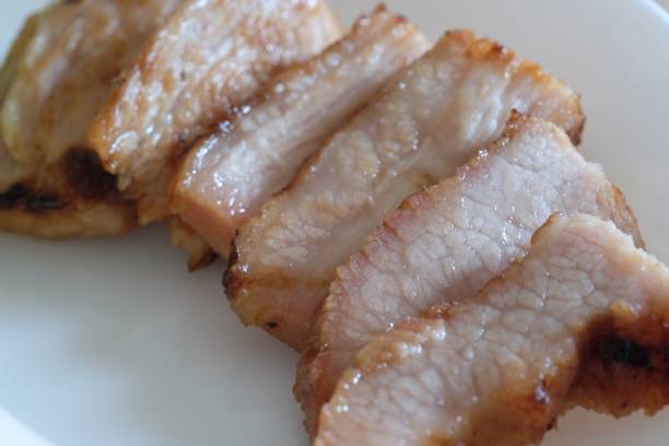 istock piece of roasted pork on white plate 1083721916