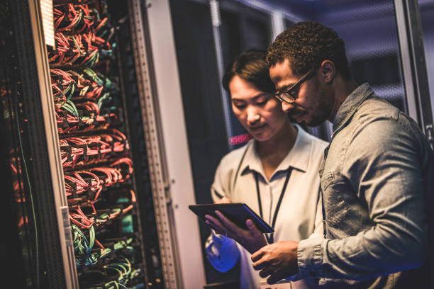 istock IT engineers using a digital tablet in the server room of a data center 1083723260