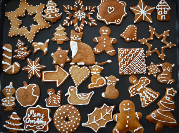 istock Gingerbread cookies decorated with royal icing on baking sheet 1083723298