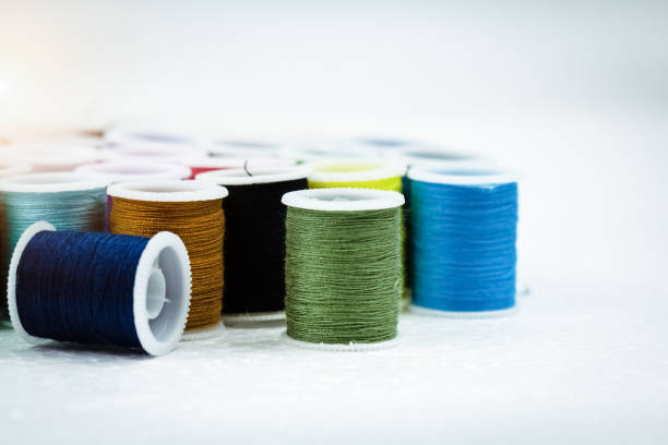 istock The roll of thread on background,needlework,craft,sewing and tailoring concept,blurry light around 1083723338