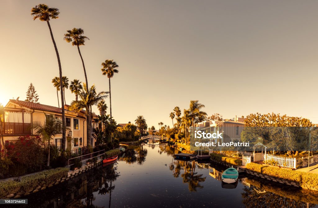 Venice in Los Angeles, canals at sunset Venice Canals - Los Angeles 

Note for inspectors: hope the properties are fine, there are similar images in the library:

https://www.istockphoto.com/photo/beautiful-venice-homes-gm898767988-248008773

https://www.istockphoto.com/photo/district-venice-los-angeles-california-united-states-gm629340970-111950681

https://www.istockphoto.com/photo/canals-in-venice-los-angeles-california-gm861457864-142640365

https://www.istockphoto.com/photo/riverside-real-estate-gm94330919-4893410 California Stock Photo