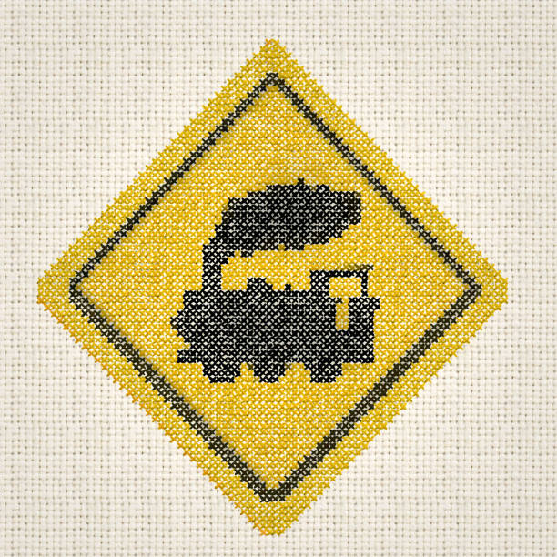 yellow black embroidered diamond shaped train road crossing sign Embroidery and stitch pattern by contributor