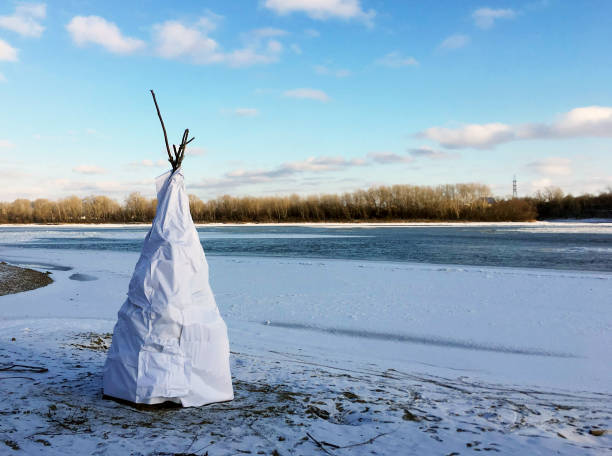 istock Hut of branches covered with white tarpaulin 1083728548