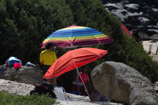 colorful umbrellas on the beach - cape town beach crowd people imagens e fotografias de stock