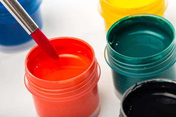 istock bottle paints on white, gouache, brush close up 1083730050