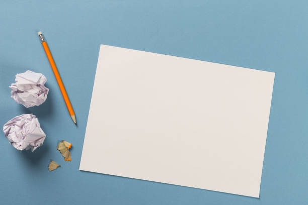 istock Pencils with sharpening shavings with white paper sheets on coloured backgroung, Office tool, rolled paper 1083730108