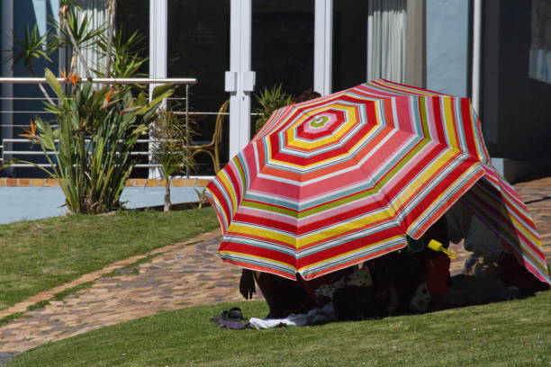 colorful umbrella on the beach - cape town beach crowd people imagens e fotografias de stock