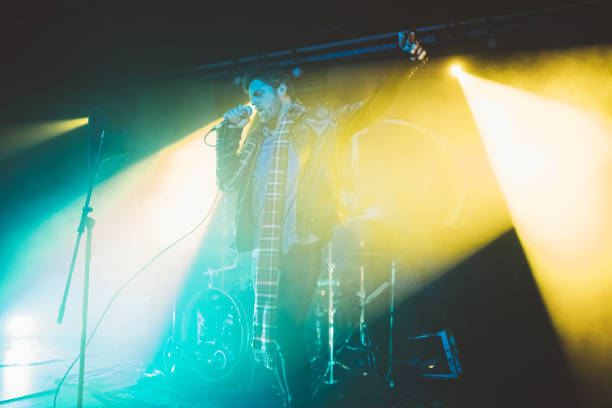 istock Singer performing on concert at nightclub 1083736250
